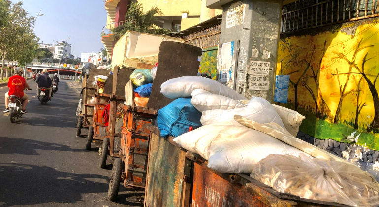 Tired of the old smelly garbage truck, leachate leaking into the street